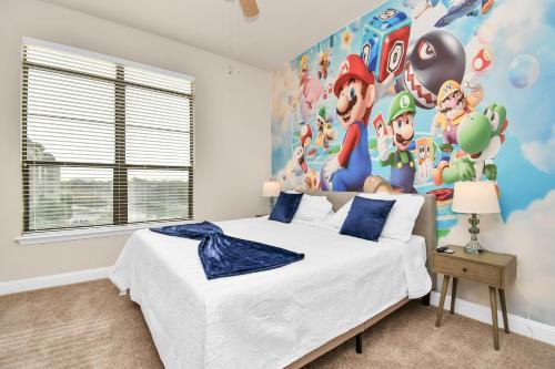 a bedroom with a bed and a mural of mickey mouse at Nintendo Super Mario Arcade - 2BR-NRG-Med-Center-Galleria in Houston