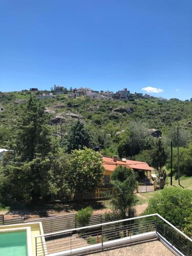 a house with a view of a hill at Sierra Alta Carlos Paz in Villa Carlos Paz