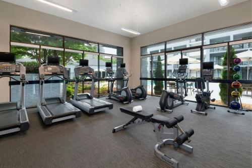 a gym with treadmills and cardio equipment in a building at Courtyard by Marriott Perimeter Center in Atlanta