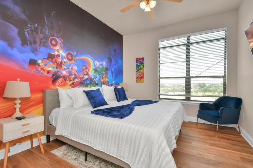 a bedroom with a large bed with a painting on the wall at The Super Mario Bros Movie - 2BR-NRG-Med Center-Galleria in Houston