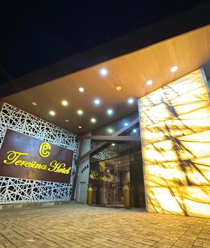 a store front of a building with a sign on it at TERESINA HOTEL in Teresina