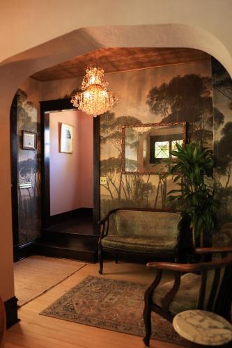 a living room with a chandelier and a couch at Marianna Stoltz House in Spokane