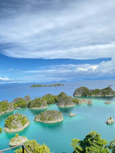 an island group of islands in the water at Fam Homestay in Fam