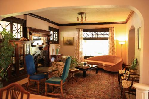 a living room with a couch and a chair at Marianna Stoltz House in Spokane