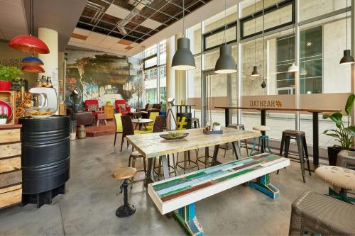 a dining room with a table and chairs at Courtyard by Marriott Berlin City Center in Berlin