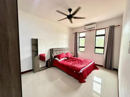 a bedroom with a bed and a ceiling fan at 2 story house in Bachok