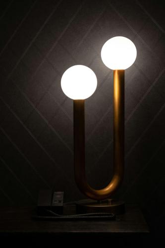 a pair of lights in a dark room at Epicurean Atlanta, Autograph Collection in Atlanta