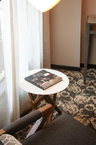a book sitting on a table in a room at Epicurean Atlanta, Autograph Collection in Atlanta