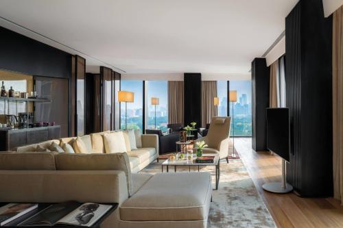 a living room with a couch and a table at Bvlgari Hotel Beijing in Beijing
