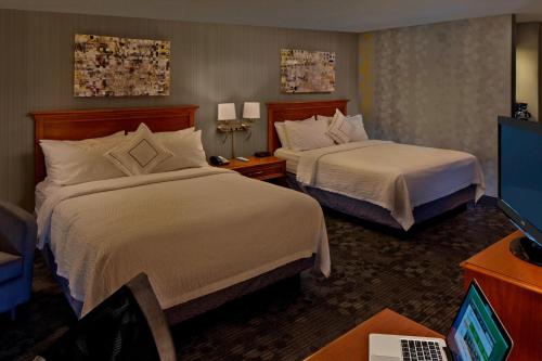 Ένα ή περισσότερα κρεβάτια σε δωμάτιο στο Courtyard Hartford Cromwell