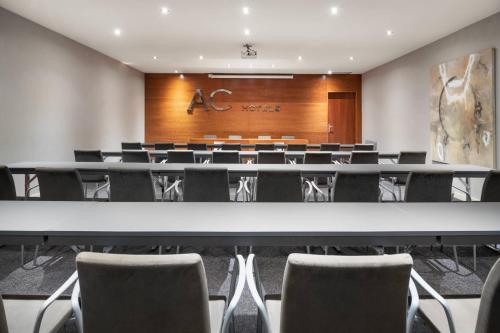 a conference room with a large table and chairs at AC Hotel Badajoz by Marriott in Badajoz
