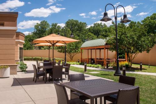 a patio with a table and chairs and a gazebo at Courtyard Fort Meade BWI Business District in Annapolis Junction