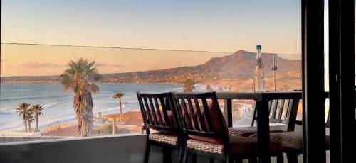 a table and chairs with a view of the beach at Luxury, Ocean View, Pool, Jacuzzi, Valle de Guadalupe, Los Portales De Garcia, Splash, Encanto Restaurants, Surf Breaks in Primo Tapia, Rosarito in Rosarito