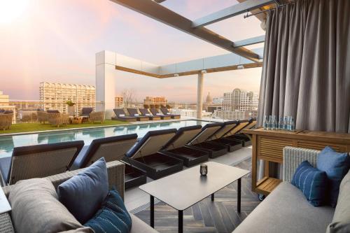 a pool on the roof of a building at The Otis Hotel Austin, Autograph Collection in Austin