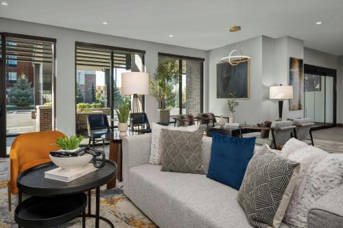 a living room with a couch and a table at Courtyard by Marriott Bozeman in Bozeman