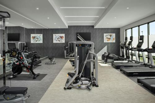 a gym with treadmills and exercise bikes in it at Courtyard by Marriott Bozeman in Bozeman
