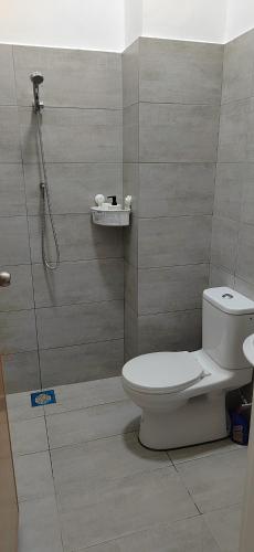 a bathroom with a toilet and a shower at Mars Homestay in Alor Setar