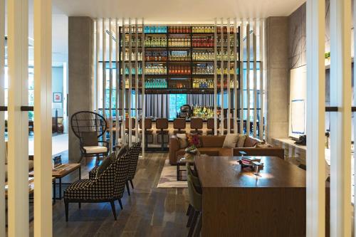 a living room with a couch and a table at Renaissance Atlanta Airport Gateway Hotel in Atlanta