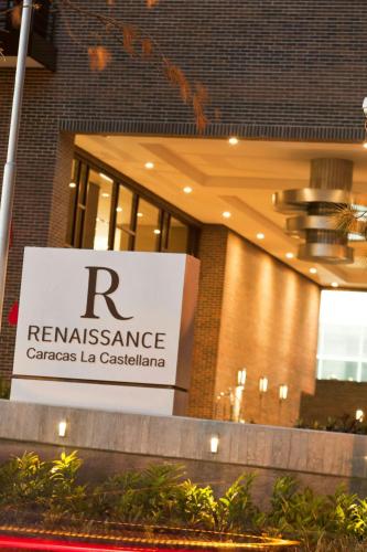 a sign in front of a building with aryanassuranceannis la casita at Renaissance Caracas La Castellana Hotel in Caracas