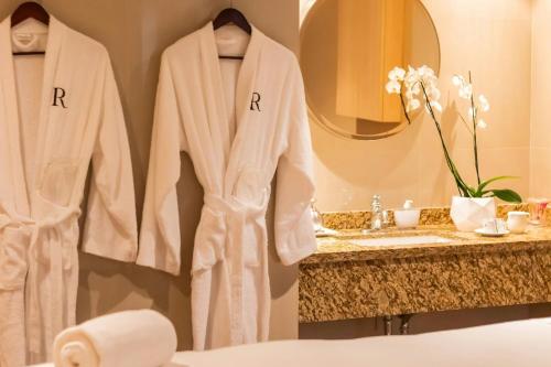 a robe on a rack in a bathroom at Renaissance Caracas La Castellana Hotel in Caracas