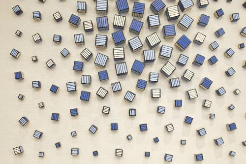 a pattern of books on a wall at AC Hotel by Marriott Atlanta Airport Gateway in Atlanta