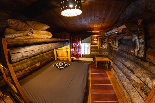 Postel nebo postele na pokoji v ubytování Bear Lodge Ylläs