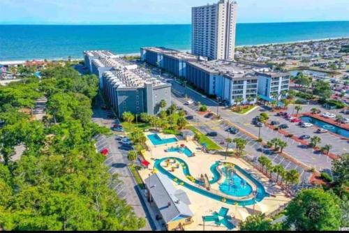 an aerial view of a resort with a pool at Luxe by the Sea - 5-Star Beachfront Escape in Myrtle Beach