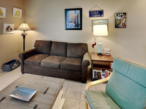 a living room with a couch and a coffee table at Beach Club Condo in Padre Island