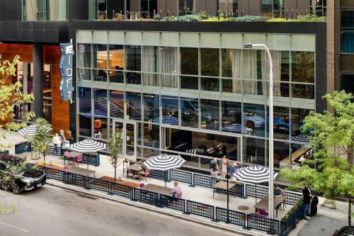 an overhead view of a building with tables and umbrellas at Aloft Chicago Mag Mile in Chicago