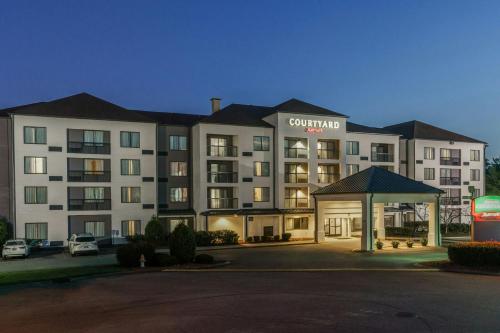 a hotel building with a gazebo in front of it at Courtyard by Marriott Nashville at Opryland in Nashville