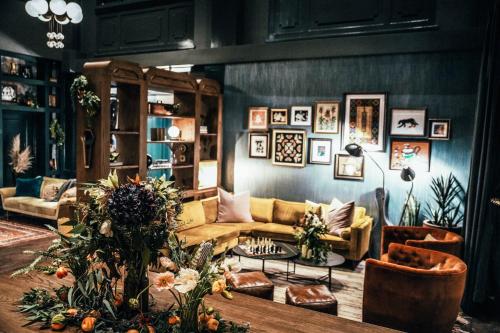 a living room with a couch and a table at Hotel Indigo Nashville - The Countrypolitan in Nashville