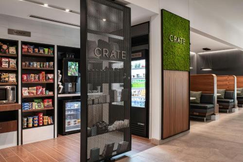 a coffee shop with a cafe sign on the wall at Courtyard by Marriott Cleveland TN in Cleveland