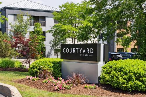a sign in front of a building at Courtyard Burlington Williston in Burlington