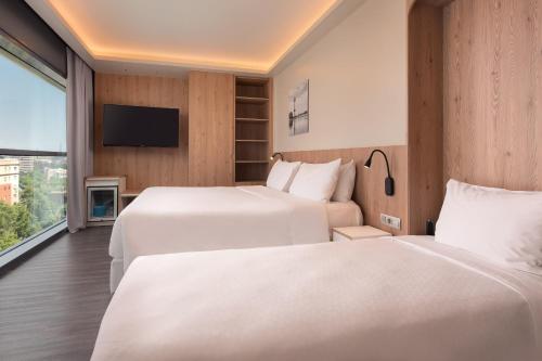 Ένα ή περισσότερα κρεβάτια σε δωμάτιο στο Four Points by Sheraton Barcelona Diagonal