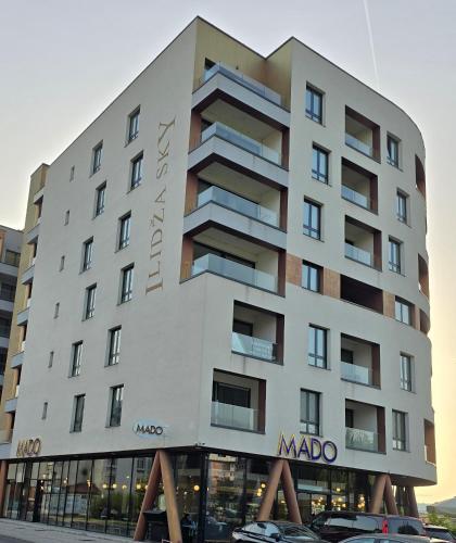 a large white building with a sign on it at ILiDZA SKY in Sarajevo