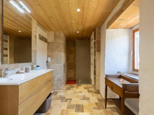 a bathroom with a sink and a mirror at Maison de village 8 personnes à Loudervielle avec Wifi - FR-1-695-71 in Loudenvielle