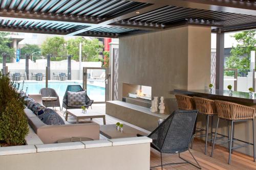a patio with a bar and chairs and a pool at AC Hotel Atlanta Downtown in Atlanta