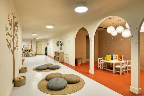 two meditation spheres on the floor of a room with arches at Domes of Corfu, Autograph Collection in Glyfada
