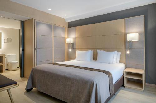 Letto o letti in una camera di AC Hotel Victoria Suites by Marriott