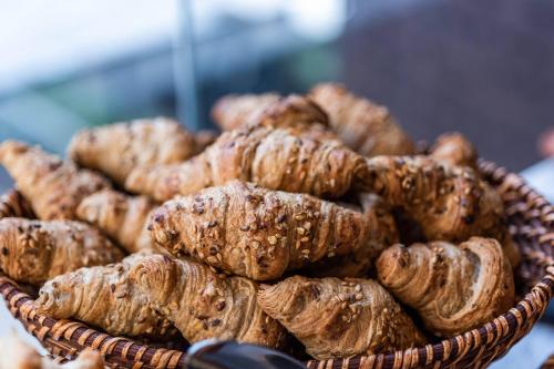 a basket full of pastries on a table at AC Hotel by Marriott Bogota Zona T in Bogotá