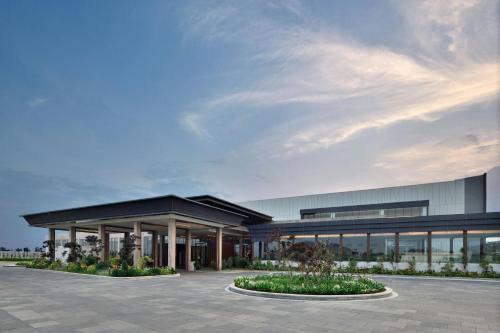 a rendering of the exterior of a building at JW Marriott Hotel Bengaluru Prestige Golfshire Resort & Spa in Bengaluru