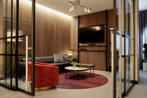 a living room with a couch and a table at Sheraton Nashville Brentwood in Brentwood