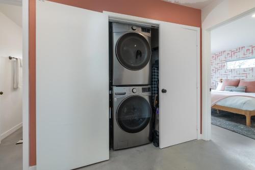 a room with two washing machines in a room at Peaceful Desert Escape with Pool, Fire Pit and Stargazing Views in Yucca Valley