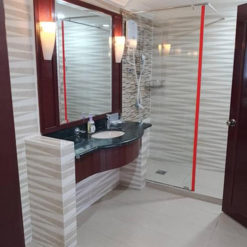 a bathroom with a sink and a shower at Fantastic appartment at times square Kuala Lumpur in Kuala Lumpur