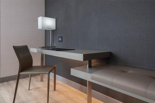 a desk and a chair in a room at AC Hotel by Marriott Atlanta Midtown in Atlanta