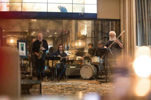 a group of people playing music in a room at Andell Inn in Kiawah Island