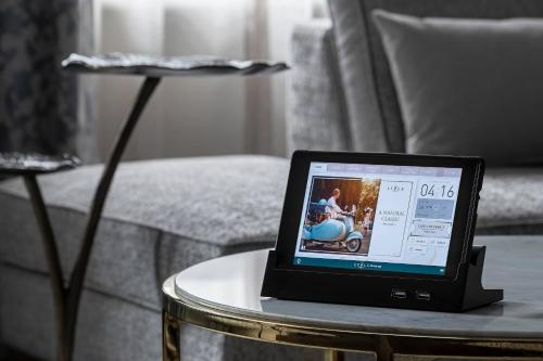 a laptop computer sitting on a table in a living room at The Lytle Park Hotel, Autograph Collection in Cincinnati
