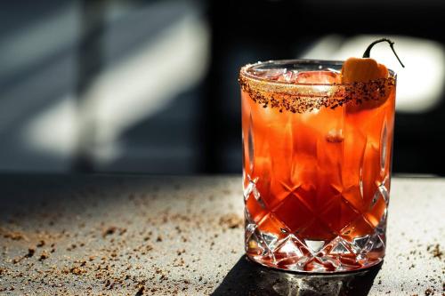 a drink sitting on top of a table at The Lytle Park Hotel, Autograph Collection in Cincinnati
