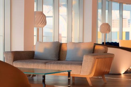 a living room with a couch and a table at Paragraph Resort & Spa Shekvetili, Autograph Collection in Shekvetili