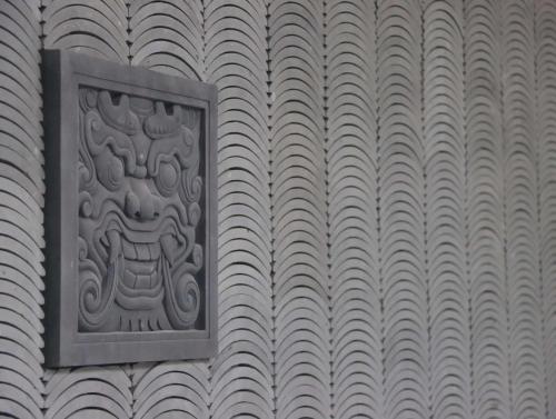 a metal plaque on the side of a building at Kempinski Residences Guangzhou - Free shuttle between hotel and Exhibition Center during Canton Fair & Exhibitor registration Counter in Guangzhou